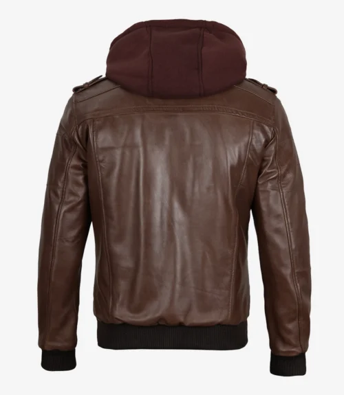 Brown leather jacket with a dark brown hood viewed from the back. Features include ribbed cuffs and hem, with structured shoulders. Stylish and casual.