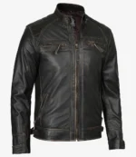 Sleek black leather jacket with a zipper front, chest pockets, and quilted shoulders. The rugged yet modern style conveys a bold, edgy tone.