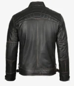 Black leather jacket with quilted shoulders and detailed stitching, viewed from the back. The tone is rugged and stylish, conveying a classic look.