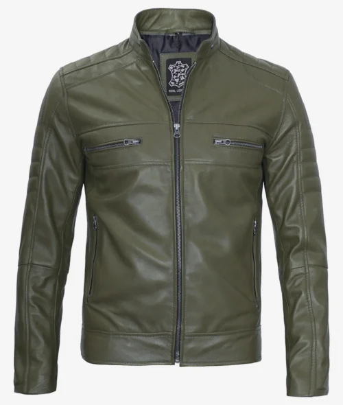 Olive green leather jacket with a high collar and symmetrical design. It features two chest zip pockets, side zip pockets, and a front zipper closure. The style is sleek and modern.