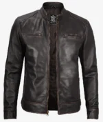 A sleek dark brown leather jacket with a front zipper, high collar, and two chest pockets. The jacket exudes a stylish, rugged vibe.