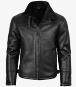 Black leather jacket with front zipper, high plush-lined collar, and buckle detail. The sleek, modern design conveys a cool, edgy vibe.