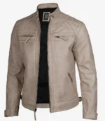 A beige leather jacket with quilted shoulder panels, zippered pockets, and an open front revealing a black interior. The style is sleek and modern.