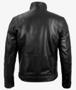 Back view of a black leather jacket with a smooth finish, featuring a high collar, defined seams, and buttoned cuffs. The style is sleek and modern.