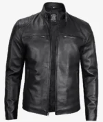 Black leather jacket with a high collar and zippered pockets, exuding a sleek and edgy look. The front zipper is partially open, highlighting its modern style.