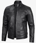 Sleek black leather jacket displayed on a plain background. Features include a stand collar, front zipper, and two zippered chest pockets, giving a stylish and edgy look.