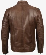 Brown leather jacket viewed from the back, featuring quilted padding on shoulders and sleeves, and vertical seam details, conveying a rugged style.