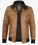 Brown leather jacket with a front zipper, multiple pockets, and black ribbed collar and cuffs. The design is rugged yet stylish, exuding a casual, confident vibe.