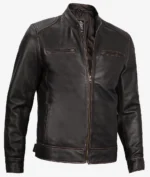 Dark brown leather jacket with a stand collar, front zipper, and zippered pockets. The sleek design conveys a stylish, modern vibe.
