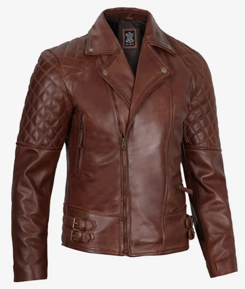 Brown leather jacket with quilted shoulder design, zipped pockets, and buckle accents on the sides. The jacket has a rugged and stylish look.