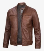 Brown leather jacket with a sleek design, featuring two front zippered pockets and a visible interior lining. The style is modern and effortlessly cool.