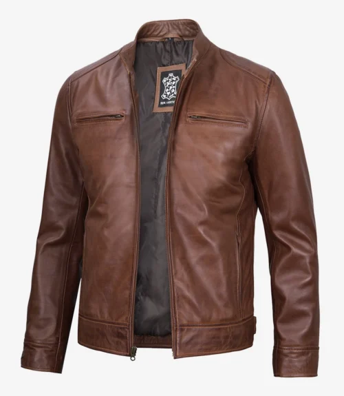 Brown leather jacket with a sleek design, featuring two front zippered pockets and a visible interior lining. The style is modern and effortlessly cool.