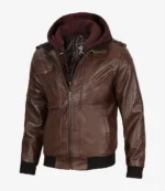 Brown leather jacket with a removable dark brown hoodie. It features multiple zippered pockets and ribbed cuffs, conveying a rugged, stylish look.