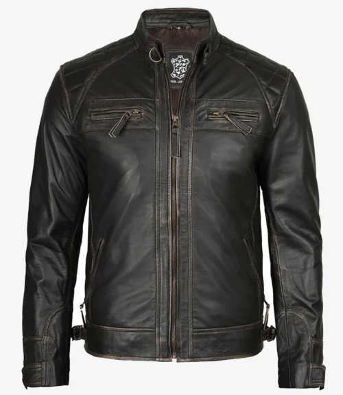 Black leather jacket with a high collar and zipper detail. Features quilted shoulder patches and angled chest pockets, exuding a rugged, stylish vibe.