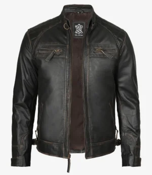 A sleek black leather jacket displayed against a white background. It features a high collar, zippered chest pockets, and a stylish quilted pattern on the shoulders.
