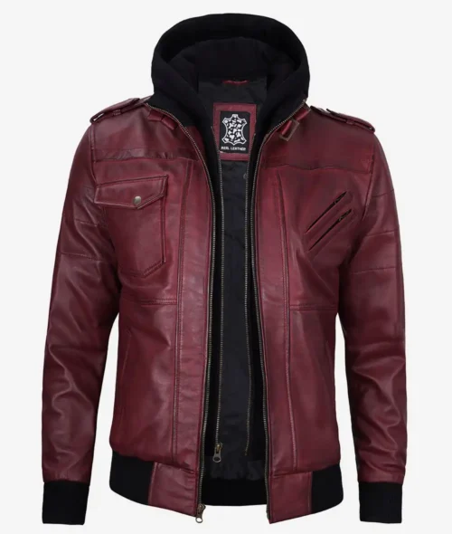 Maroon leather jacket with multiple pockets and zip details, featuring a black hooded insert. Exudes a stylish and edgy vibe.