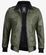 Green leather jacket with multiple pockets, zippered front, and epaulettes, exuding a rugged and stylish vibe. Black ribbed cuffs and collar.