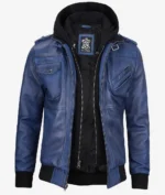 Blue leather jacket with a black hoodie insert. Features zipped pockets, shoulder epaulettes, and ribbed cuffs. Stylish, modern, and bold design.