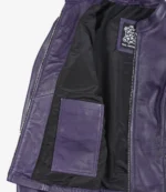 Open purple leather jacket showing black lining and an inner pocket, tagged with Real Leather label. The tone is sleek and stylish.