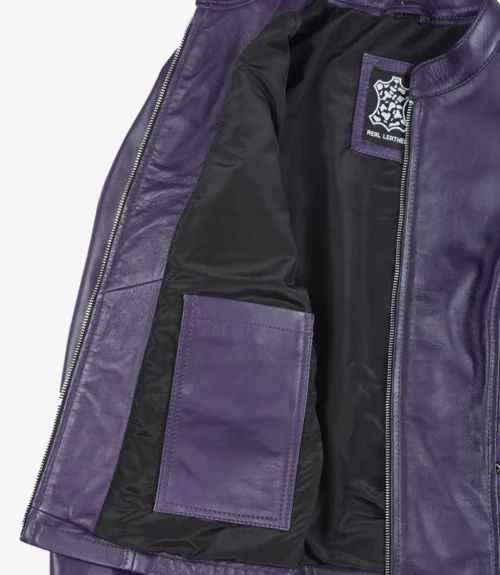 Open purple leather jacket showing black lining and an inner pocket, tagged with Real Leather label. The tone is sleek and stylish.