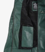 Open green leather jacket showing interior. Features black lining, a label reading Real Leather, and a visible inner pocket. Stylish and modern.