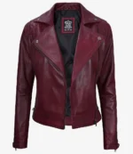 Burgundy leather jacket with a classic biker style, featuring asymmetric zippers, notch lapels, and quilted shoulders. The tone is chic and edgy.