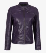 Purple leather jacket with a mandarin collar, zipper front, and four zippered pockets. The design is sleek and modern, conveying a bold style.