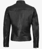 Rear view of a black leather jacket with quilted shoulder panels and sleeves. It features zippered cuffs, conveying a sleek and edgy style.