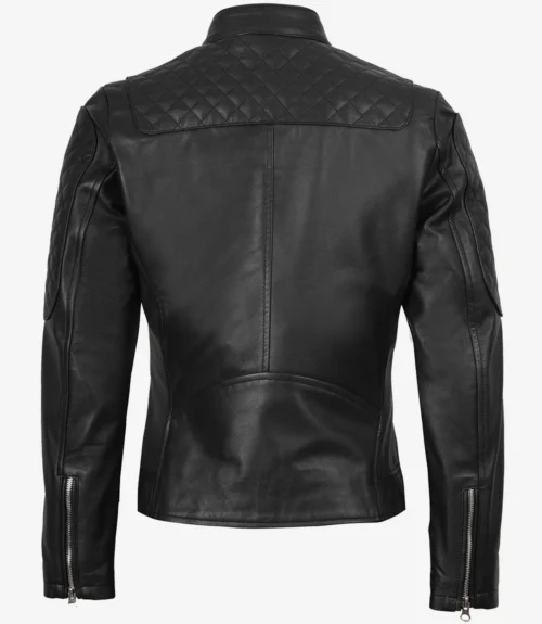 Rear view of a black leather jacket with quilted shoulder panels and sleeves. It features zippered cuffs, conveying a sleek and edgy style.