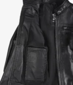Open black leather jacket with a visible interior pocket on the left side. The exterior features a zippered pocket and a high collar with button detail.