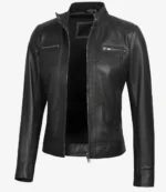 Black leather jacket on a white background. Features a stand collar, full-length zipper, and two zippered chest pockets, conveying a stylish, edgy tone.