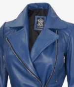 Close-up of a blue leather jacket with a large collar and silver zippers. A tag inside labeled Real Leather is visible. The tone is sleek and stylish.