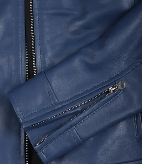 Close-up of a blue leather jacket showing a zippered sleeve and front zipper. The texture is smooth and well-defined, conveying a sleek, modern feel.