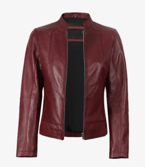 A maroon leather jacket with a sleek, minimalist design, featuring a zippered front and a high collar. The jacket conveys a chic and stylish tone.