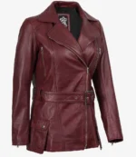 Burgundy leather jacket with a diagonal zipper, wide lapels, and a belted waist. Features zippered pockets and a buttoned flap pocket on the side.