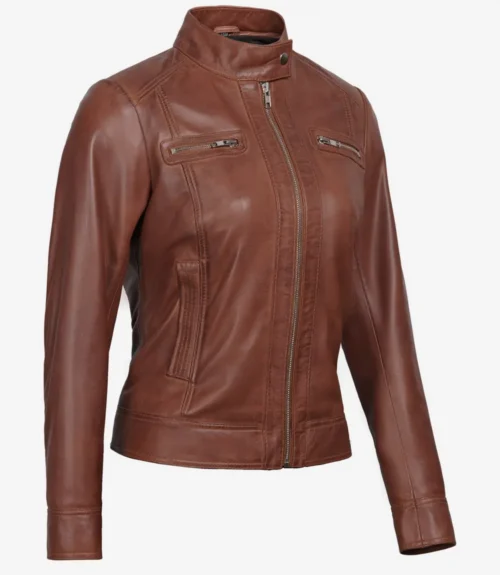 Brown leather jacket with a sleek design, featuring a high collar and zippered front. It has zippered chest pockets, creating a stylish and modern look.