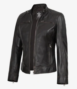 A sleek black leather jacket with a zipper front, chest pockets, and a modern collar. The jacket conveys a stylish and edgy tone.