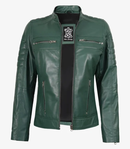 Green leather jacket with silver zippers on chest and pockets, standing in a neutral posture. The tag inside displays a logo and Real Leather.