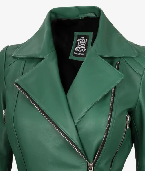 Green leather jacket with a wide collar and silver zipper details. The label reads Real Leather. The style is bold and modern.