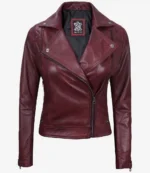 Deep burgundy leather jacket with asymmetric zipper, silver snap buttons, and notched lapels. It conveys a stylish and edgy tone.
