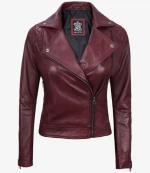 Deep burgundy leather jacket with asymmetric zipper, silver snap buttons, and notched lapels. It conveys a stylish and edgy tone.