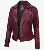 A vibrant maroon women's leather jacket with silver zipper details and a notched lapel, exuding a bold, stylish, and edgy tone.