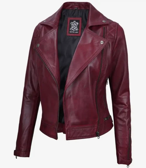 A vibrant maroon women's leather jacket with silver zipper details and a notched lapel, exuding a bold, stylish, and edgy tone.