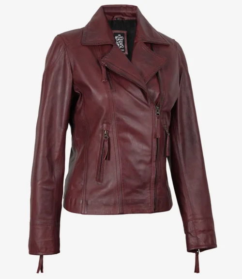 A stylish maroon leather jacket with an asymmetrical zipper and a sleek, fitted design. It has a notched collar and zippered pockets, exuding a bold, chic vibe.