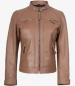 Tan leather jacket with a high collar and silver zip details on the chest and pockets. The sleek design and smooth texture convey a modern, stylish look.