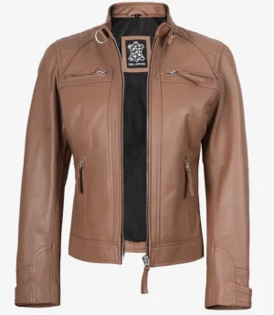 Brown leather jacket with a double zipper, standing collar, and front pockets. The inner lining is black with a label featuring a logo design.