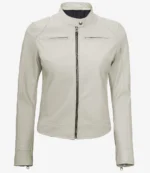 White leather jacket with a sleek design, featuring a front zipper, two chest pockets, and a high collar with a button closure, exuding elegance and style.