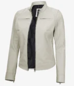 Beige leather jacket with a standing collar and open front, featuring stitched detailing and zipped chest pockets. The interior lining is dark.