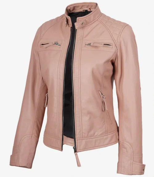 Light pink leather jacket with a quilted shoulder design and a sleek zipper front. Features zippered chest and side pockets, offering a stylish look.