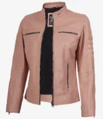 Pink leather biker jacket with a stand collar, zippered pockets, and quilted shoulders. The jacket is unzipped, revealing a black inner lining.